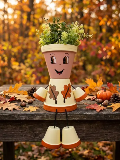 Őszi cserép figura tölgyfa levéllel.  25 cm+ a lógó lábak